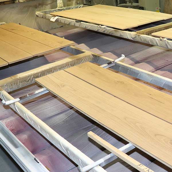 Two planks being stained at our factory | Italian Wide Plank Wood Flooring Tavolato Veneto